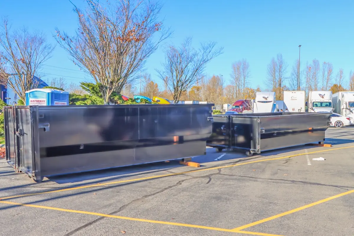 Professional dumpster rental service with roll-off container on residential driveway in Shoreline